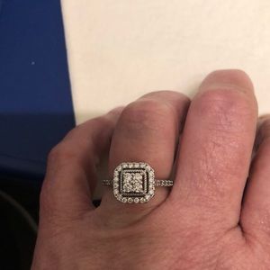 This very nice princess cut ring give away price
